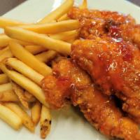 Sweet Chili Chicken Tenders And Fries · Four chicken tenders tossed with sweet chili sauce (spicy) served with a heaping order of fr...