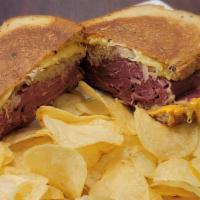 Classic Reuben Sandwich Combo · 7 oz Corned Beef, Sauerkraut, Russian Dressing & Melted Swiss Cheese on grilled Rye Bread se...
