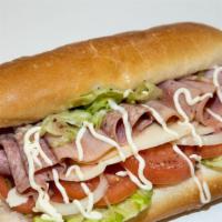Italian Cold Cut Combo · Fresh cut Ham, Capicolo and Salami lunch meat on a fresh baked sub roll served with chips an...