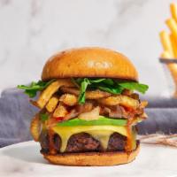 Anytime You Need A French Burger · Plant-based impossible patty grilled and topped with fries, avocado, caramelized onions, ket...