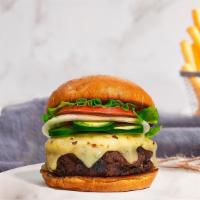Papi Peno Burger · Plant-based impossible patty grilled and topped with melted vegan cheese, jalapenos, buttere...