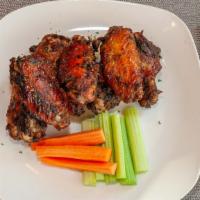 Baked Wings · Choice of sauce. Served with carrots and celery. Your choice of blue cheese or ranch.