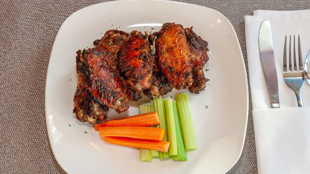 Baked Wings · Choice of sauce. Served with carrots and celery. Your choice of blue cheese or ranch.