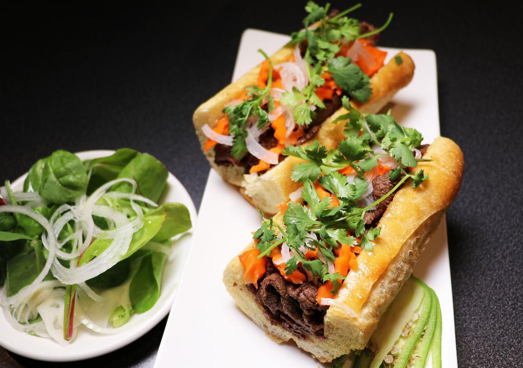 Charbroiled Beef Sandwich - Bánh Mì Bò Nướng · Baguette filled with charbroiled beef, house special mayo, onion, cilantro, carrot pickles and Jalapeño.