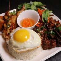 Combination Rice Plate- Cơm Đặc Biệt · Charbroiled Pork, Tiger Shrimp Skewers, Crispy Prawn Beancurd, Eggroll.
