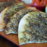 Zaatar Flatbread · Thyme, marjoram, sumac, sesame seed, olive oil.