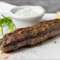 Seekh Kabob Appetizer · One succulent ground beef kabob served with yogurt and dill.