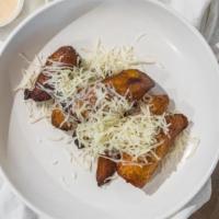 Sweet Plantains · Fried ripe sweet plantains topped with  monterey jack cheese  (5 per serving)