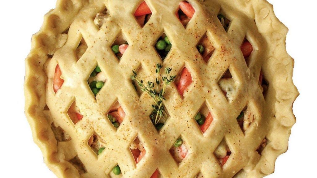 Small Chicken Pot Pie · Our savory pot pie is loaded with chunks of free-range chicken, peas, carrots and our signature thyme gravy all inside our buttery scratch made crust. The small is 5