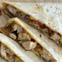 Simpol Chicken Quesadilla · Seasoned grilled chicken, sweet onions, sweet corn, tomato, blended cheese & sour cream