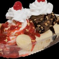 Banana Split · Choice of soft serve ice cream, three toppings , whip cream and a cherry.