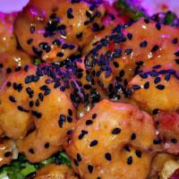 Shotgun Shrimp · Breaded shrimp lightly fried, tossed in a spicy cream sauce served on a bed of shredded lett...