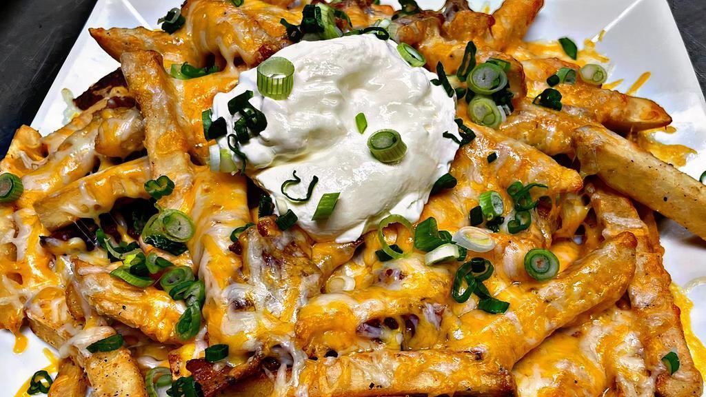Loaded Fries · Cheddar cheese, Bacon, Sour Cream, Scallions.