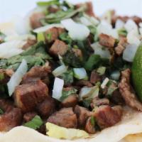 Steak Tacos · Three Mexican Style Tacos, Soft Corn Tortillas, Onion, Lime Juice, Cilantro and Radishes.