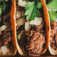 Pork Carnitas Tacos · Three Mexican Style Carnitas, Soft Corn Tortillas, Onion, Lime Juice, Cilantro and Radishes