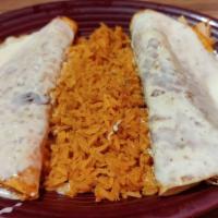 Lunch Enchiladas Verdes · Spicy. Two shredded chicken enchiladas topped with green tomatillo sauce, lettuce, sour crea...