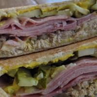 Cuban Melt  · Slow roasted Pork, Ham, Swiss, Mayo,  Mustard and pickles. Served on French white bread