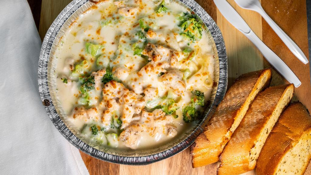Chicken Fettuccine Alfredo · Grilled marinated chicken breast, sautéed broccoli, and mushrooms in our creamy alfredo sauce, served over fettucine, topped with shredded parmesan cheese.