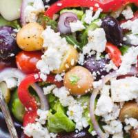 Greek Salad · Romaine lettuce, feta cheese, and fresh garden vegetables.
