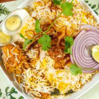 Hyderabadi Chicken Dum Biryani · Dum style cooking involves cooking rice and meat (in layers) in. Hyderabadi chicken dum biry...