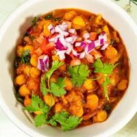 Chana Masala · Chickpeas cooked with mixed spices of coriander, chili powder and ground turmeric.