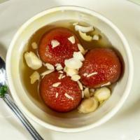 Gulab Jamun · Sweet ball made from milk dough fried until golden brown and served in sugar syrup.