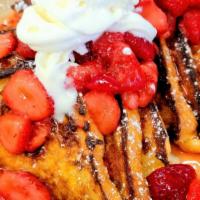 French Toast Topped With Strawberries · Golden French Toast topped with Fresh Strawberries