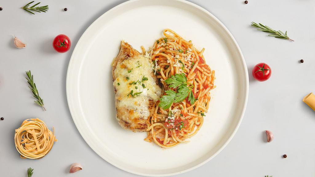 Clucking Parm Pasta · Freshly baked chicken parmesan served with rossa (red) sauce spaghetti and drizzled with parmesan cheese