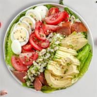 Call A Cobb Salad · Grilled chicken breast, avocado, bacon, tomato, cucumbers, hard boiled egg served over mixed...