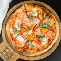 Margherita · Fresh mozzarella, basil, and infused garlic oil over red sauce.