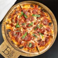 Carnie (Think Carnivore) · Spicy coppa, bacon, soppressata, balsamic pearl onion, and house blend cheese over red sauce...