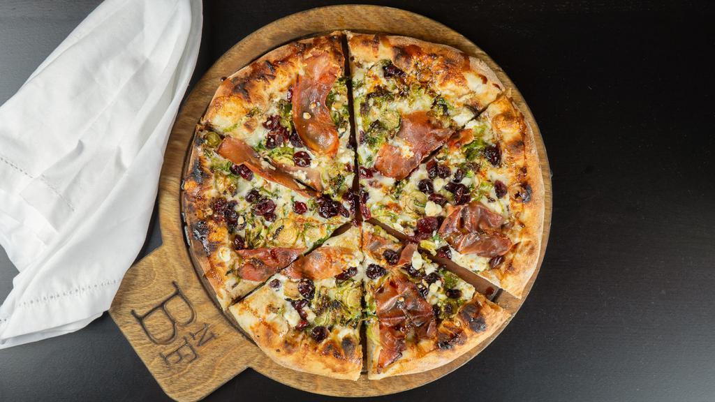 Foodie (No Sauce, No Problem) · Prosciutto, brussels sprout, crushed walnut, house blend cheese, and cranberry goat cheese over an oil and vinegar wash.