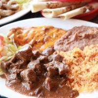 Tink'S Special Plate · One enchilada, gravy or chili, carne guisada, rice, beans and salad.