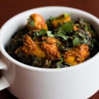 Home Style Chicken Saag · Chicken cooked in onion sauce, ginger, garlic, green pepper and spices.
