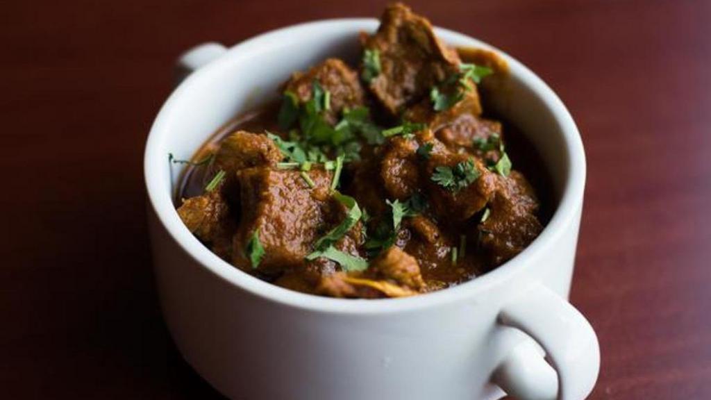 Lamb Rogan Josh · Chunks of lamb cooked in special spices and cardamom sauce.