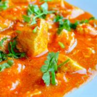 Chicken Tikka Masala · Chunks of chicken cooked in tomato and creamy sauce. Served with rice, bread and salad.