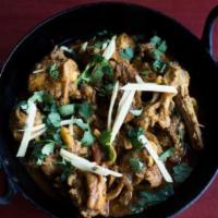 Chicken Curry · Chicken cooked in onion sauce, ginger, garlic, green chilies, cashew nuts and exotic spices....