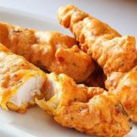 Chicken Pakora · Delicate pieces of chicken marinated in chickpeas batter and fried.