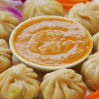 Vegetable Momo’S  · Dumplings stuffed with  eggless and steamed
