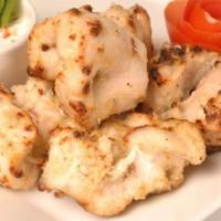 Chicken Kabob · Juicy chunks of chicken marinated in white sauce and barbeque. Served with naan and a side o...