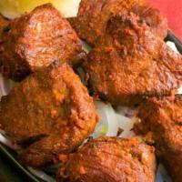Boti Lamb Kabob · Dice lamb marinated overnight with mild spiced and barbeque. Served with naan and a side of ...