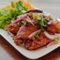 Chili Wings · Spicy. Five pieces. Crispy battered chicken wings tossed with chili, red onion, cilantro, sc...