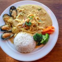Curried Seafood · Spicy. Shrimp, squid, mussel, egg, onion, scallion and celery stir-fried in yellow curry sau...