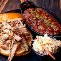 Our Iconic Pulled Pork Sandwich · Award-Winning. dry rubbed / cole slaw.