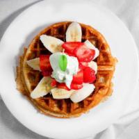 Rogier Waffle · Bananas, strawberries, Nutella, caramel, and whipped cream.