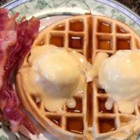 Petillon Waffle · 2 poached eggs, bacon and hollandaise. Served with syrup.