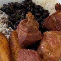 Pulled Pork · Marinated pulled pork Served with white rice, black or red beans, w/ sweet or fried plantains