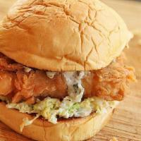 Beer Battered Crispy Salmon Sandwich · 7oz cut of fresh, Chilean Salmon, beer battered, deep fried and served on a soft, chewy pota...