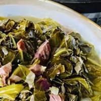 Collard Greens · Southern dish made with fresh Collard Green, ham hock or smoked turkey or vegetable stock, t...
