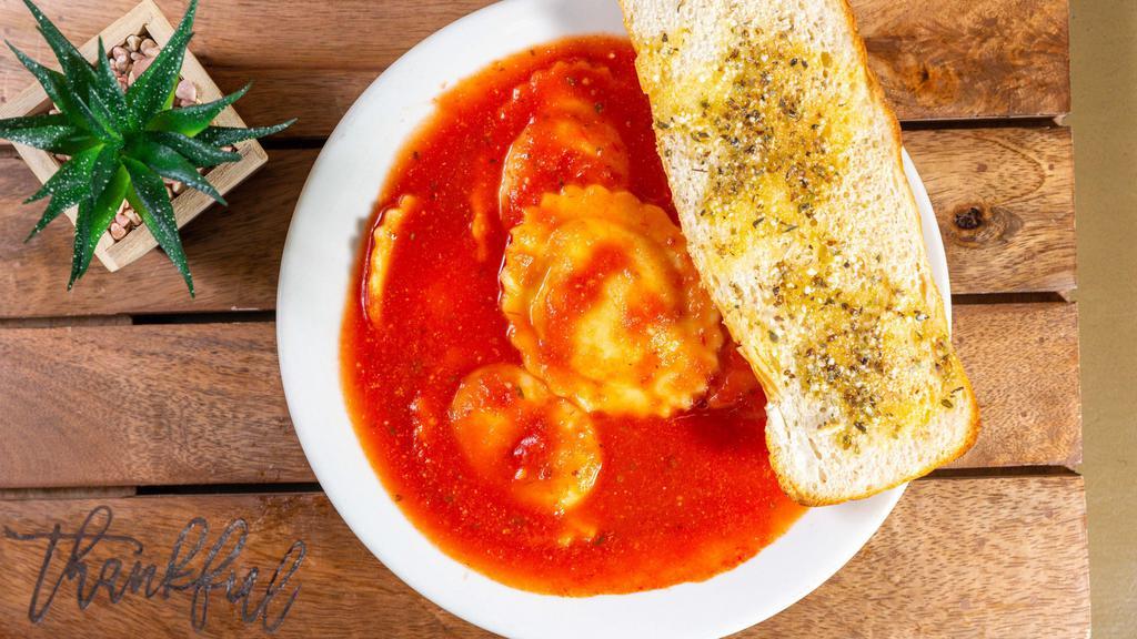 Cheese Ravioli · Pasta pillows, stuffed with a blend of cheese and spices. Topped with marinara.